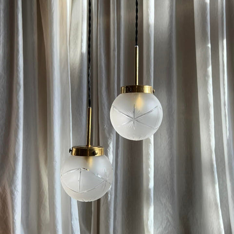 PAIR OF VINTAGE ENGRAVED GLASS GLOBE PENDANT LIGHTS WITH BRASS DETAILS, REWIRED